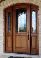 Arched Mahogany Door Installed by Bloom
